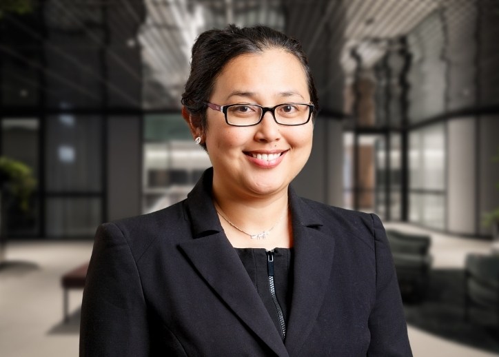 A photo of Sunita Popp looking straight ahead and smiling