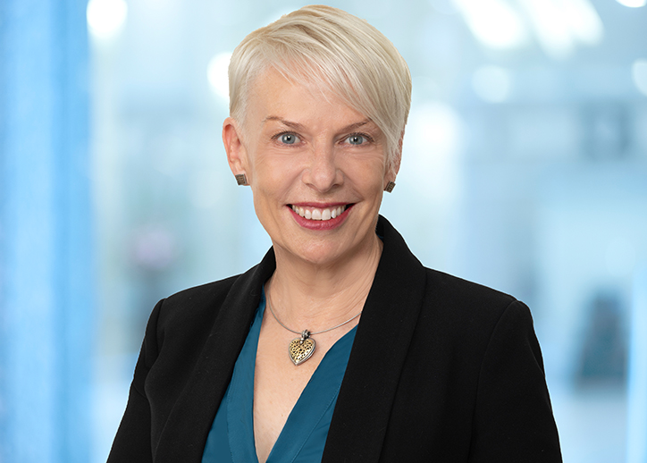 A photo of Denise Brotherton looking straight ahead and smiling